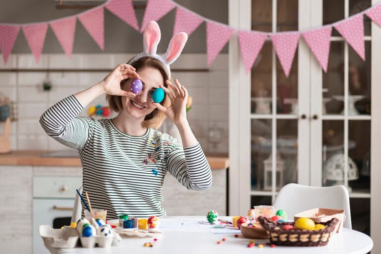 cute-adult-woman-playing-with-easter-eggs-768x512.jpg
