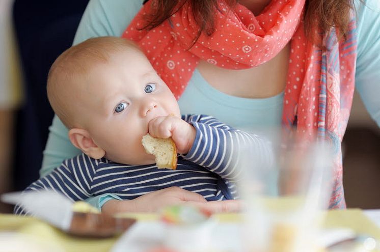 11499851-baby-boy-having-piece-of-bread.jpg