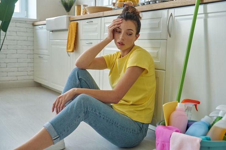 woman-sits-floor-kitchen-with-basket-laundry-baskets.jpg