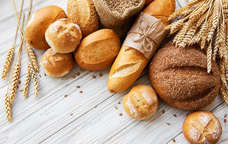 assortment of baked bread on white wooden background_ 8343 x 5283 px.jpg