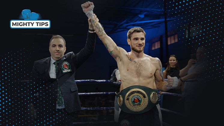 MightyTips ambassador Jevgenijs Aleksejevs with the IBO belt.jpg