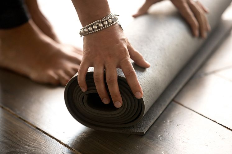 mp28195073-woman-beginning-yoga-pilates-class-at-gym-close-up.jpg