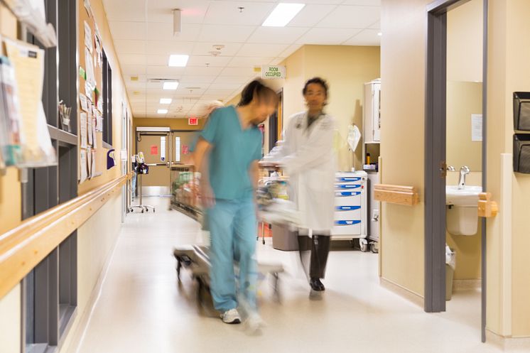 6509225-doctor-and-nurse-pulling-stretcher-in-hospital-corridor.jpg