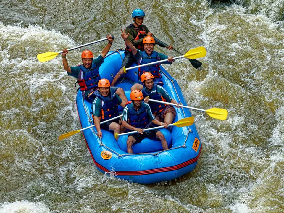 The tourists are rafting on Ayung River