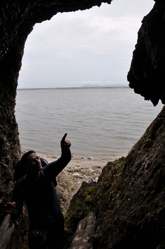 Dr Sebastian Breitenbach looking for samples in one of the caves