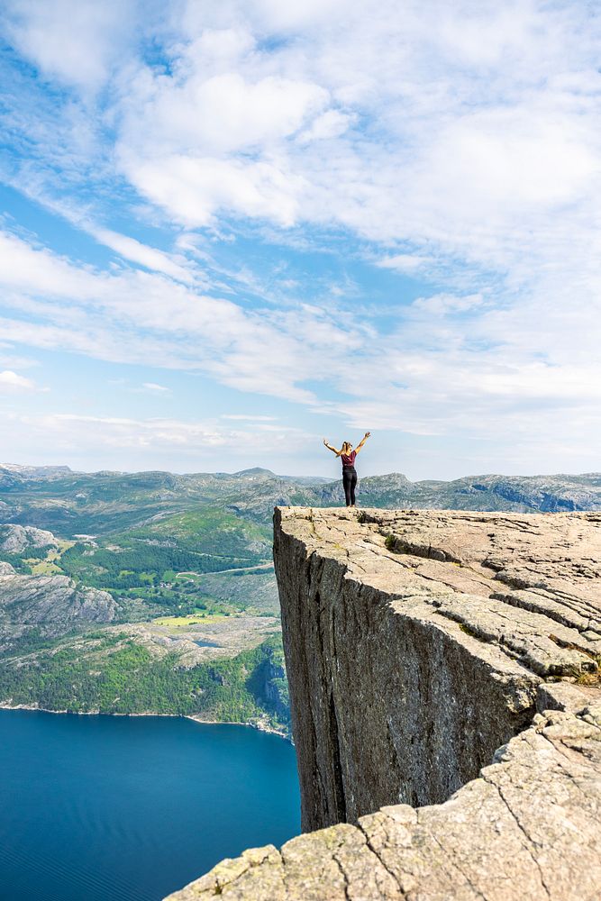 Woman on top of Preikestolen